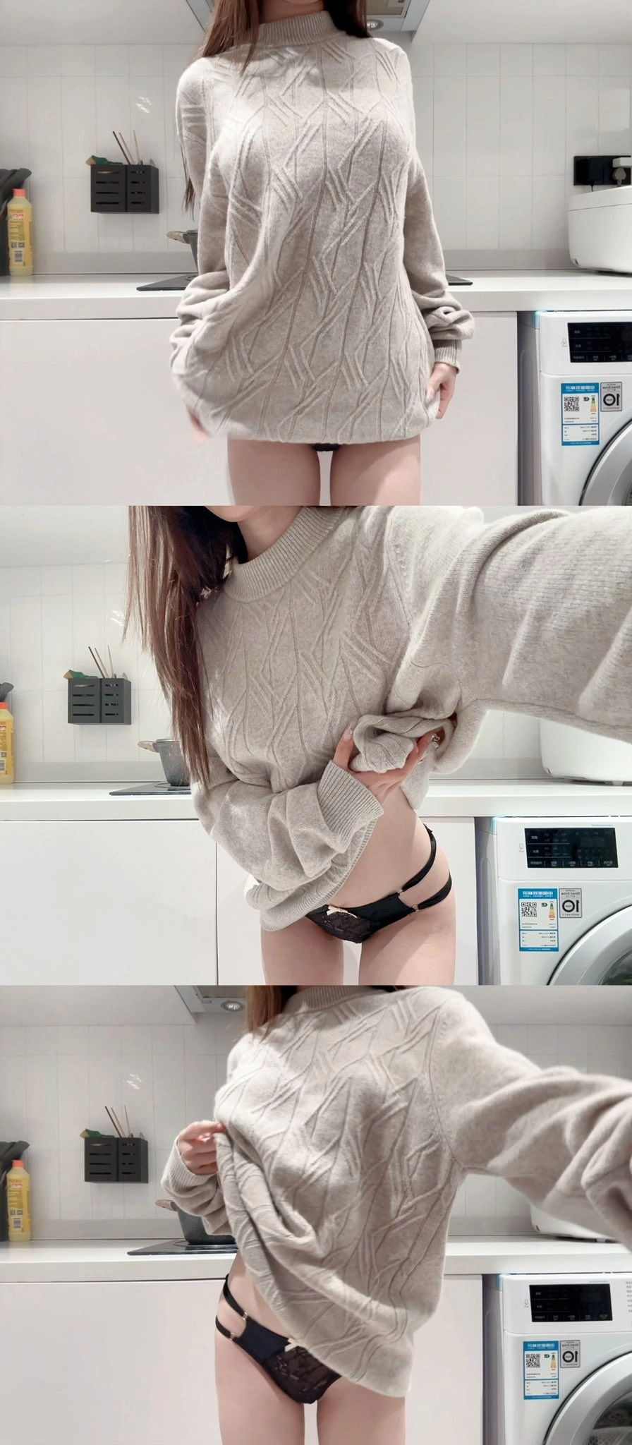 一位穿着灰色衬衫和黑色内衣的女性在洗衣机前拍了一张自拍。